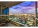 City view from the Balcony at night, featuring a skyline under a vibrant, colorful sunset; urban living at 4525 Dean Martin Dr # 2806, Las Vegas, NV 89103
