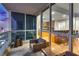 Stylish balcony with seating area, offering breathtaking city views and seamless indoor-outdoor living at 4525 Dean Martin Dr # 2806, Las Vegas, NV 89103