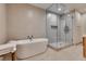 Bright bathroom with a soaking tub, separate glass shower, and contemporary tilework; luxurious design at 4525 Dean Martin Dr # 2806, Las Vegas, NV 89103