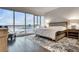 Bedroom with expansive city views, a plush bed, and a serene, minimalist aesthetic; urban comfort at 4525 Dean Martin Dr # 2806, Las Vegas, NV 89103