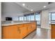 Kitchen area with wood cabinets and countertop space with a view of the city at 4525 Dean Martin Dr # 2806, Las Vegas, NV 89103