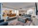 Open concept living room and kitchen with counter seating and modern furniture at 4525 Dean Martin Dr # 2806, Las Vegas, NV 89103