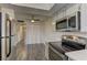 Updated kitchen with stainless steel appliances, white cabinets and laminate floors at 4666 Monterey Cir # 4, Las Vegas, NV 89169
