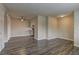 Spacious living room featuring modern laminate flooring and neutral paint at 4666 Monterey Cir # 4, Las Vegas, NV 89169