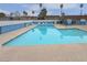 Large community pool with lounge chairs provides a perfect place to relax and enjoy the sun at 4666 Monterey Cir # 4, Las Vegas, NV 89169