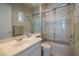 Bathroom with shower-over-tub, single sink vanity, and large mirror at 52 Via Paradiso St, Henderson, NV 89011