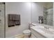 Bathroom featuring a single sink vanity, toilet, and a shower with glass door at 52 Via Paradiso St, Henderson, NV 89011