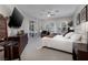 Bedroom with white bedding, large windows, and shutters, providing ample natural light at 52 Via Paradiso St, Henderson, NV 89011