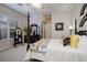 This bedroom features four poster bed, shutters, and decorative accents at 52 Via Paradiso St, Henderson, NV 89011