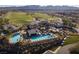 Stunning aerial view of a community pool and clubhouse with expansive golf course views at 52 Via Paradiso St, Henderson, NV 89011