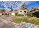 Charming single-story home with brick driveway, tiled roof and meticulously maintained landscaping at 52 Via Paradiso St, Henderson, NV 89011