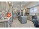 Kitchen with granite countertops, stainless steel appliances, and central island cooktop at 52 Via Paradiso St, Henderson, NV 89011