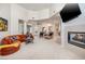 Spacious living room featuring a fireplace, plush seating, and an open floor plan at 52 Via Paradiso St, Henderson, NV 89011