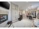 Bright living room with fireplace, large storage cabinets, and tile floors in an open concept layout at 52 Via Paradiso St, Henderson, NV 89011