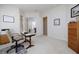 Office with neutral carpet and walls, desk, printer, and view of en-suite bath at 52 Via Paradiso St, Henderson, NV 89011
