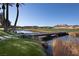 Scenic community with a wooden bridge spanning a tranquil pond surrounded by lush greenery at 52 Via Paradiso St, Henderson, NV 89011