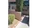 Gated entrance to a townhome with desert landscaping and a courtyard at 5273 Wave Dancer Ln, Las Vegas, NV 89118