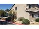 Exterior view of a home with desert landscaping and covered parking at 5273 Wave Dancer Ln, Las Vegas, NV 89118