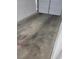 A garage with a two-car garage door and concrete floors at 5273 Wave Dancer Ln, Las Vegas, NV 89118