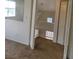 Bright hallway leads to the second floor with a closet and neutral carpeting at 5273 Wave Dancer Ln, Las Vegas, NV 89118