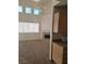 Open concept living area with fireplace and large windows at 5273 Wave Dancer Ln, Las Vegas, NV 89118