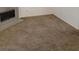 Spacious living room featuring neutral carpet and a cozy fireplace at 5273 Wave Dancer Ln, Las Vegas, NV 89118