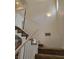 Staircase with neutral carpet and white railing at 5273 Wave Dancer Ln, Las Vegas, NV 89118