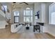 Bright living room featuring high ceilings, modern fireplace, and expansive windows at 5573 San Florentine Ave, Las Vegas, NV 89141