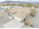 Aerial view of home with a long driveway, mountain view, and extra storage in back at 620 W Leffner Dr, Pahrump, NV 89060