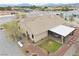 An aerial view showcases this homes roof, patio and mountain views at 620 W Leffner Dr, Pahrump, NV 89060