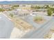 Aerial view of desert home showing expansive lot, detached garage, and circular driveway at 620 W Leffner Dr, Pahrump, NV 89060