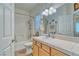 Bright bathroom featuring a tiled countertop, white sink, and shower-tub combo at 620 W Leffner Dr, Pahrump, NV 89060