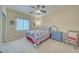 Cozy bedroom with carpet, curtains, and a bed with colorful quilt at 620 W Leffner Dr, Pahrump, NV 89060