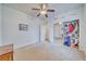 This carpeted bedroom has a ceiling fan, neutral walls, and a closet with storage at 620 W Leffner Dr, Pahrump, NV 89060