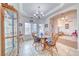 Cozy dining room featuring a chandelier, wood table with seating, and views to the living area at 620 W Leffner Dr, Pahrump, NV 89060