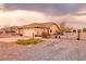 Wide shot of home, garage, landscaped front and circular driveway at 620 W Leffner Dr, Pahrump, NV 89060