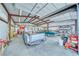 This garage features a classic truck and car, set against a backdrop of storage solutions and ample workspace at 620 W Leffner Dr, Pahrump, NV 89060