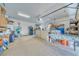 Spacious garage features epoxy floors, storage, work bench, and a rear entry door at 620 W Leffner Dr, Pahrump, NV 89060