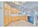 Well-lit kitchen features tiled countertops, ample cabinet space, and modern appliances at 620 W Leffner Dr, Pahrump, NV 89060