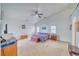 Vaulted ceiling main bedroom featuring neutral carpet and ceiling fan at 620 W Leffner Dr, Pahrump, NV 89060
