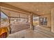 This large covered patio has brick flooring and leads out to the large gravel backyard at 620 W Leffner Dr, Pahrump, NV 89060