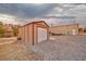 Exterior view of the shed with an additional shop nearby at 620 W Leffner Dr, Pahrump, NV 89060
