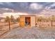 Front view of shed with plywood doors open for plenty of storage at 620 W Leffner Dr, Pahrump, NV 89060