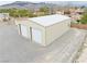 Large workshop with two garage doors and ample space for storage or projects at 620 W Leffner Dr, Pahrump, NV 89060