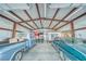 Interior of the spacious workshop with two classic cars, perfect for car enthusiasts and projects at 620 W Leffner Dr, Pahrump, NV 89060