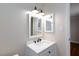Bathroom with white vanity, dark fixtures, and neutral walls at 6309 Fairbanks Rd, Las Vegas, NV 89103