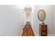 Hallway with hardwood floors, neutral walls, and decorative mirror at 6309 Fairbanks Rd, Las Vegas, NV 89103