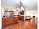 Open kitchen and living area with hardwood floors, stainless appliances, and bright natural light at 6309 Fairbanks Rd, Las Vegas, NV 89103