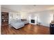 Bright living room features a white couch, hardwood floors, and a white brick fireplace at 6309 Fairbanks Rd, Las Vegas, NV 89103