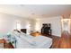 Open-concept living room with hardwood floors and a white brick fireplace at 6309 Fairbanks Rd, Las Vegas, NV 89103